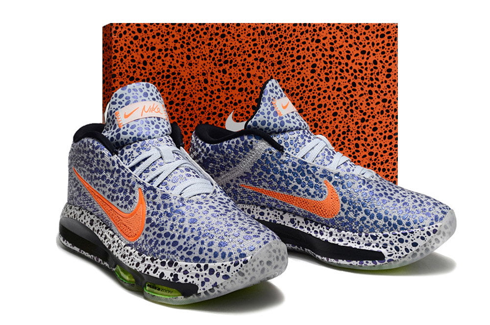 Pair of patterned blue and white Nike GT Hustle 3 shoes in front of a matching patterned box.