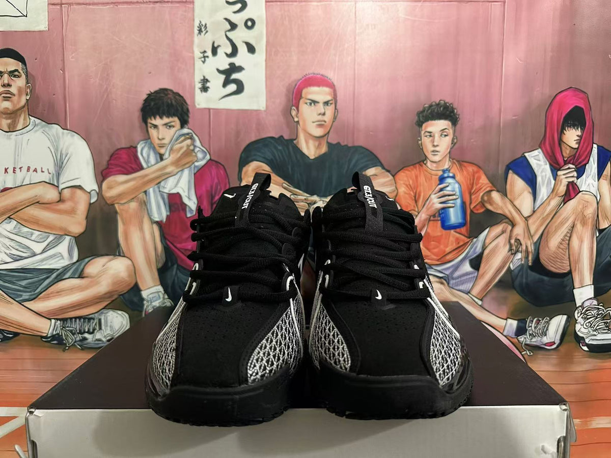 Front view of black Nike basketball shoes with white forefoot stitching
