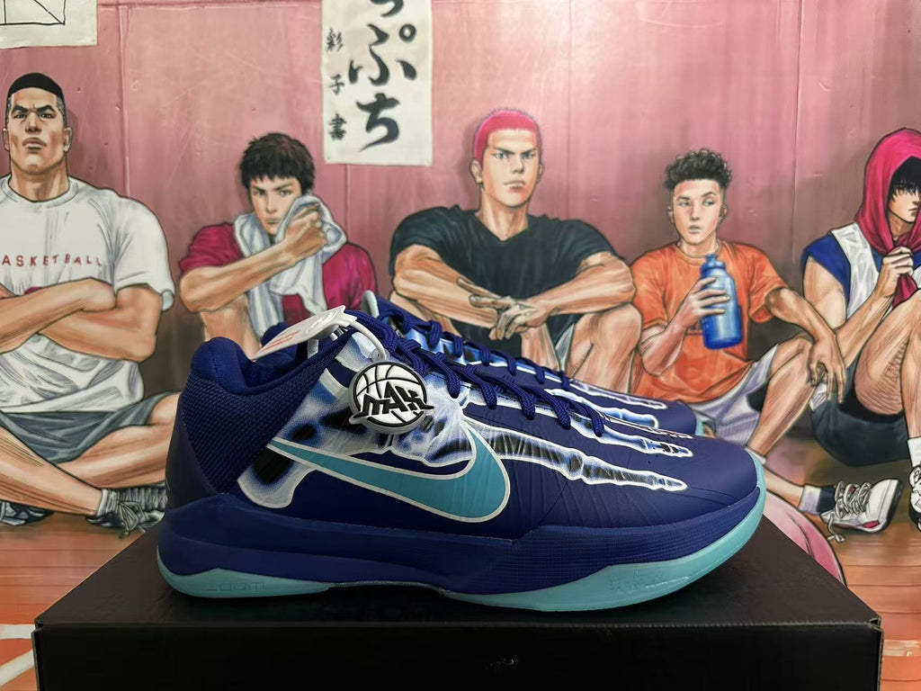 Side view of a blue Nike basketball shoe with turquoise Swoosh and outsole accents
