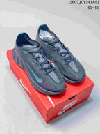 Pair of charcoal gray Nike AVA X low-top shoes with blue accents on a red shoe box
