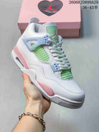Angled view of a white Air Jordan 4 Retro sneaker with pink, pale blue, and mint green details
