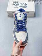 Front view showing perforated off-white toe, grey overlays, and blue laces