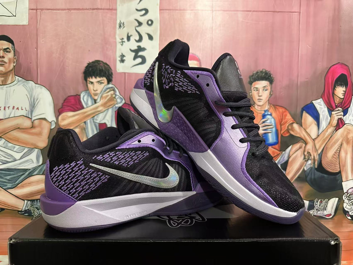 Pair of black and purple Nike Sabrina basketball shoes shown from the side.