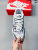 Top view showing the lace-up design, mesh tongue, and silver toe overlays.