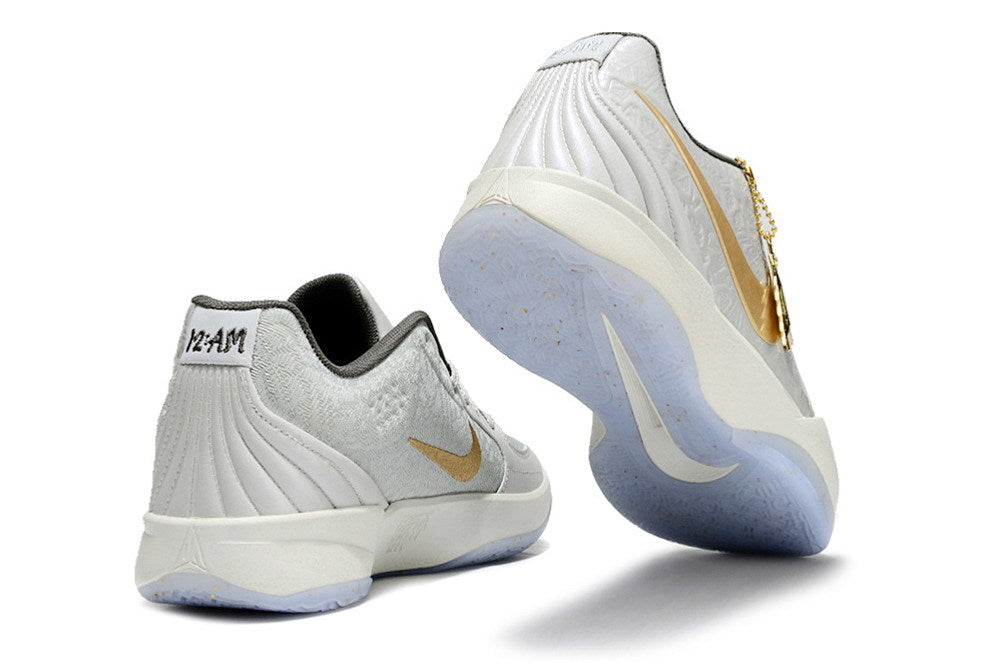 Gray and gold Ja 2 shoes shown from the heel and outsole.