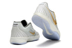 Gray and gold Ja 2 shoes shown from the heel and outsole.