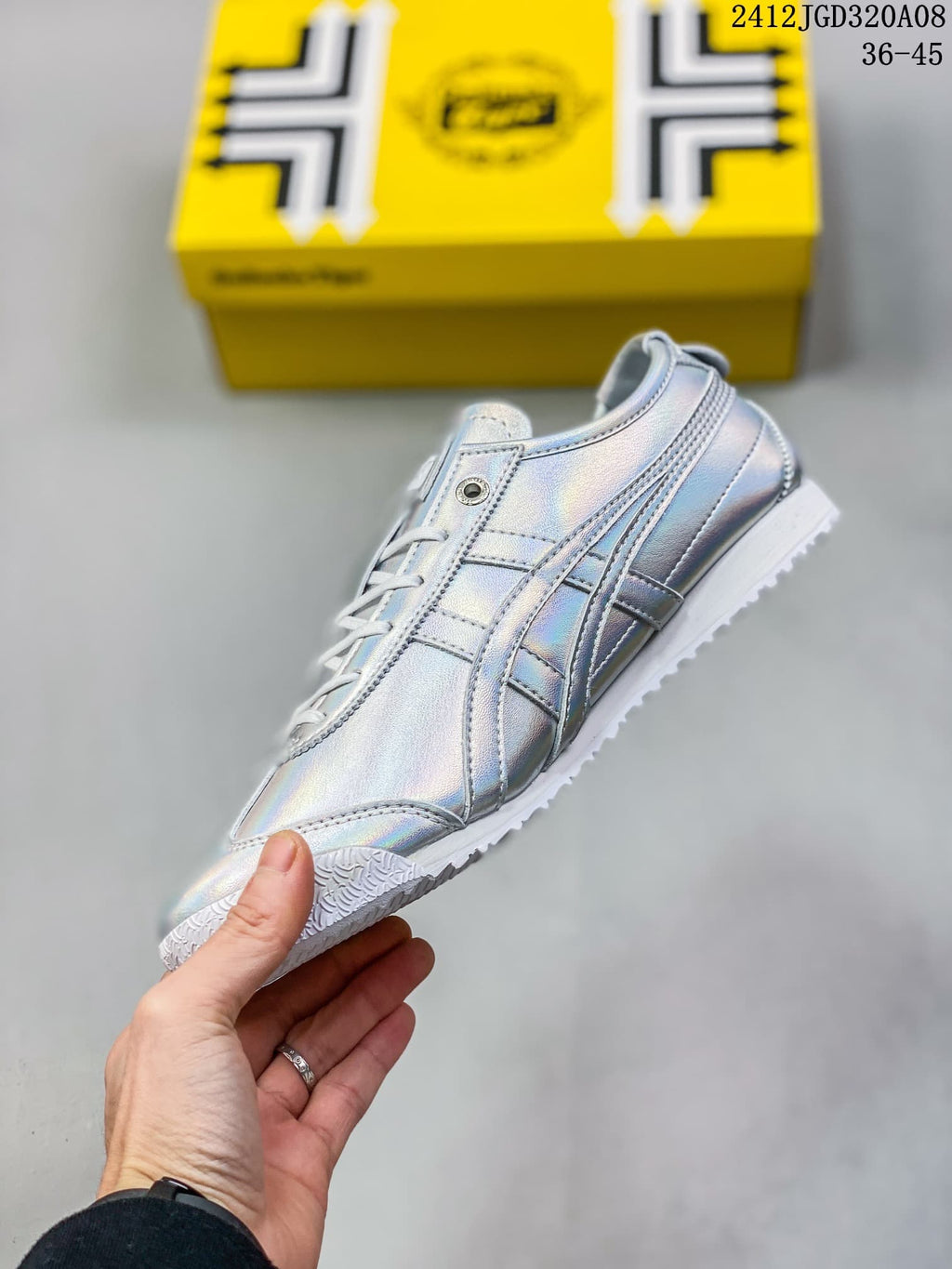 Side view of the sneaker showing the layered side stripes, lace area and low-profile sole.