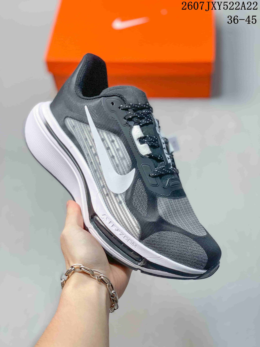 Angled side view of a Nike Air Zoom Pegasus Plus shoe showing the Swoosh and visible Air Zoom marking