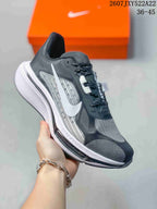 Angled side view of a Nike Air Zoom Pegasus Plus shoe showing the Swoosh and visible Air Zoom marking
