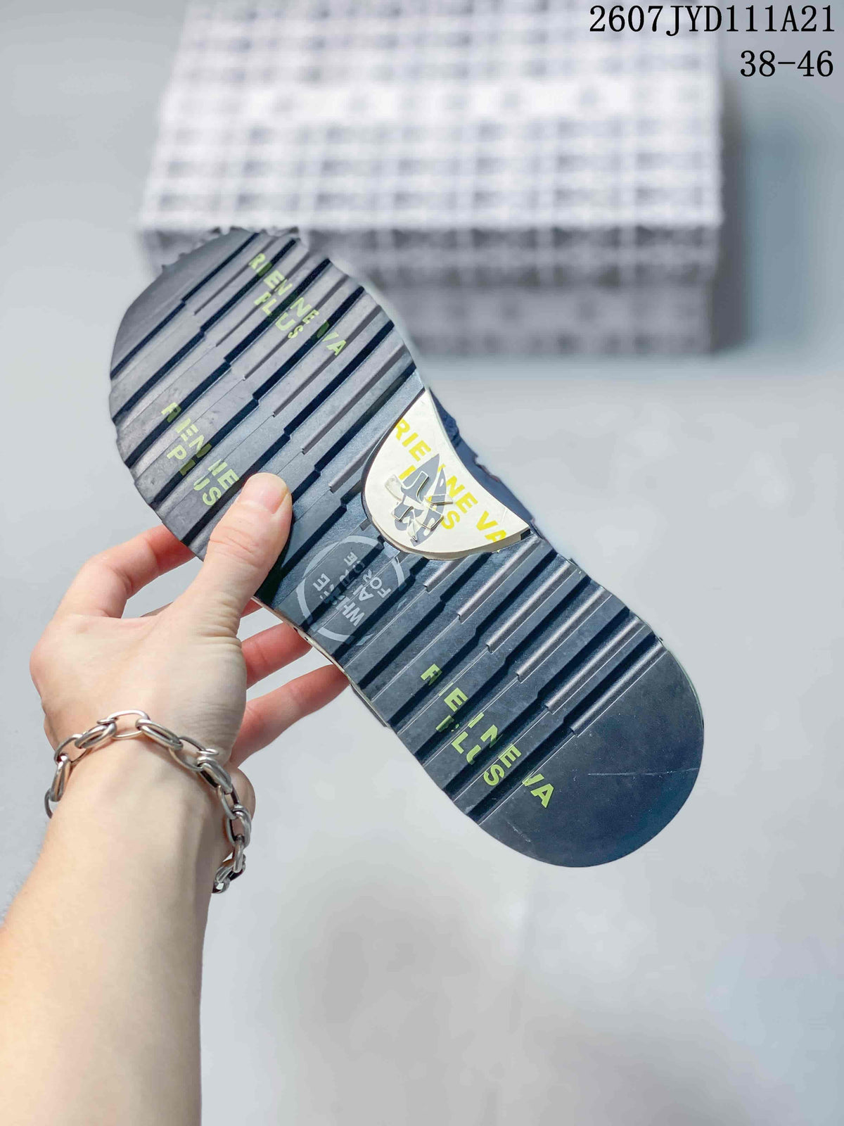 Close-up of the sneaker outsole showing horizontal tread grooves and printed graphics.