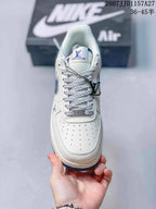 Top view showing the perforated toe box, patterned laces, tongue label, and hanging metal tag.