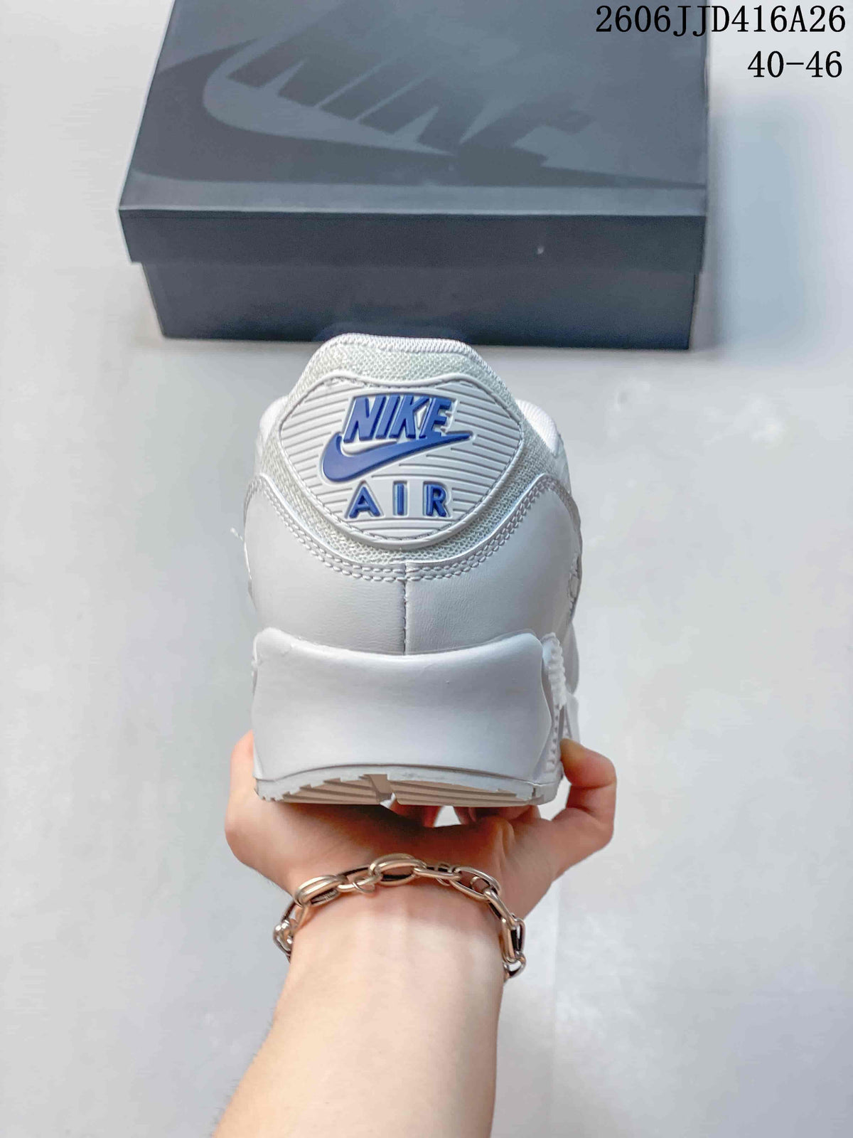 Rear view of the white sneaker showing Nike Air branding on the heel.