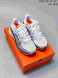 Nike Pegasus 42 running shoes shown from above on an orange shoebox, with white uppers, blue detailing and orange accents.