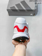 Rear view showing red heel detailing on the white Adidas Runfalcon 5.