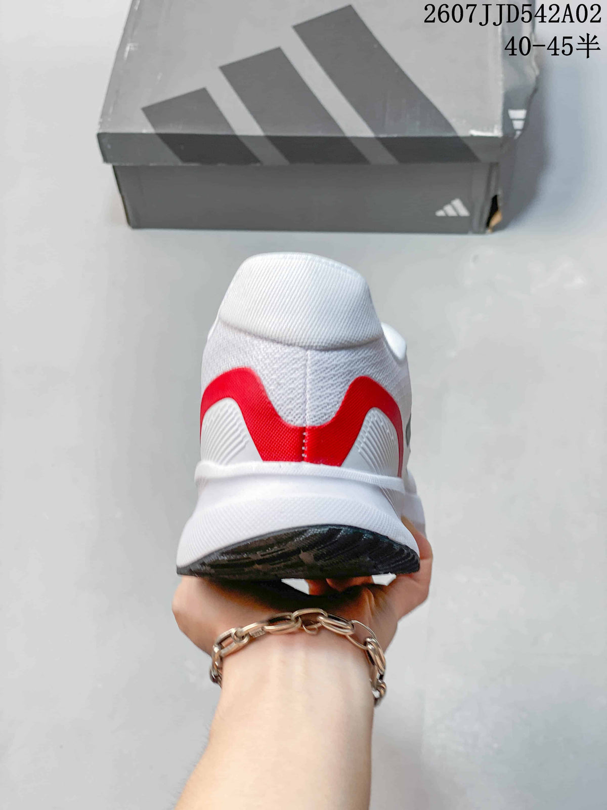 Rear view showing red heel detailing on the white Adidas Runfalcon 5.