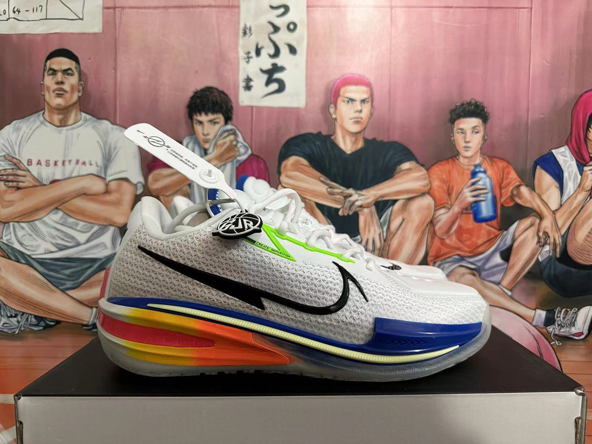 Side view showing the black Swoosh, white upper, blue trim, and multicolor heel.