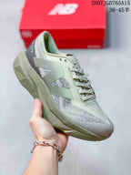 Three-quarter side view of the gray and muted purple New Balance running shoe with a sculpted sole.