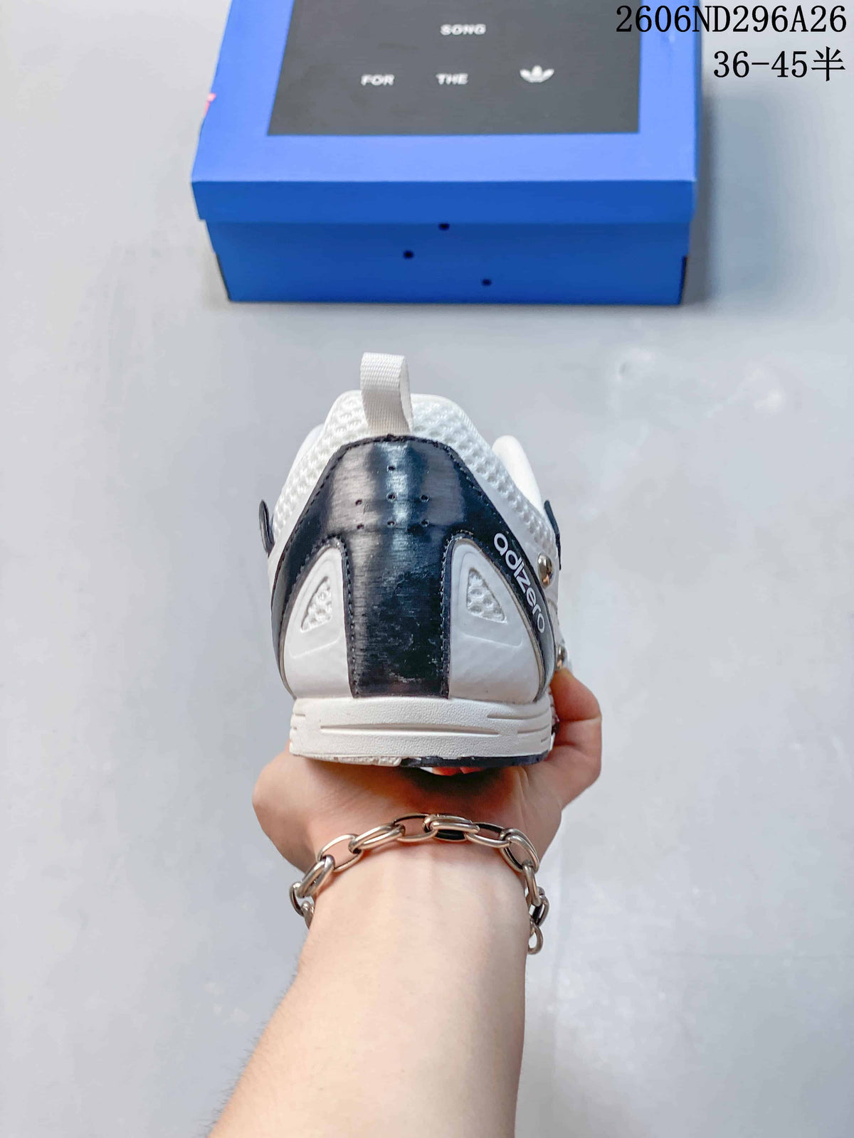 Rear view of the white sneaker showing the dark heel panel and layered heel construction.