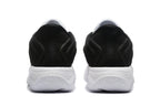 Rear view showing the black heel panels and white outsole of the shoes