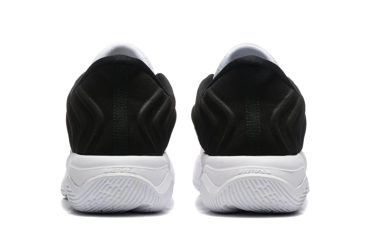 Rear view showing the black heel panels and white outsole of the shoes
