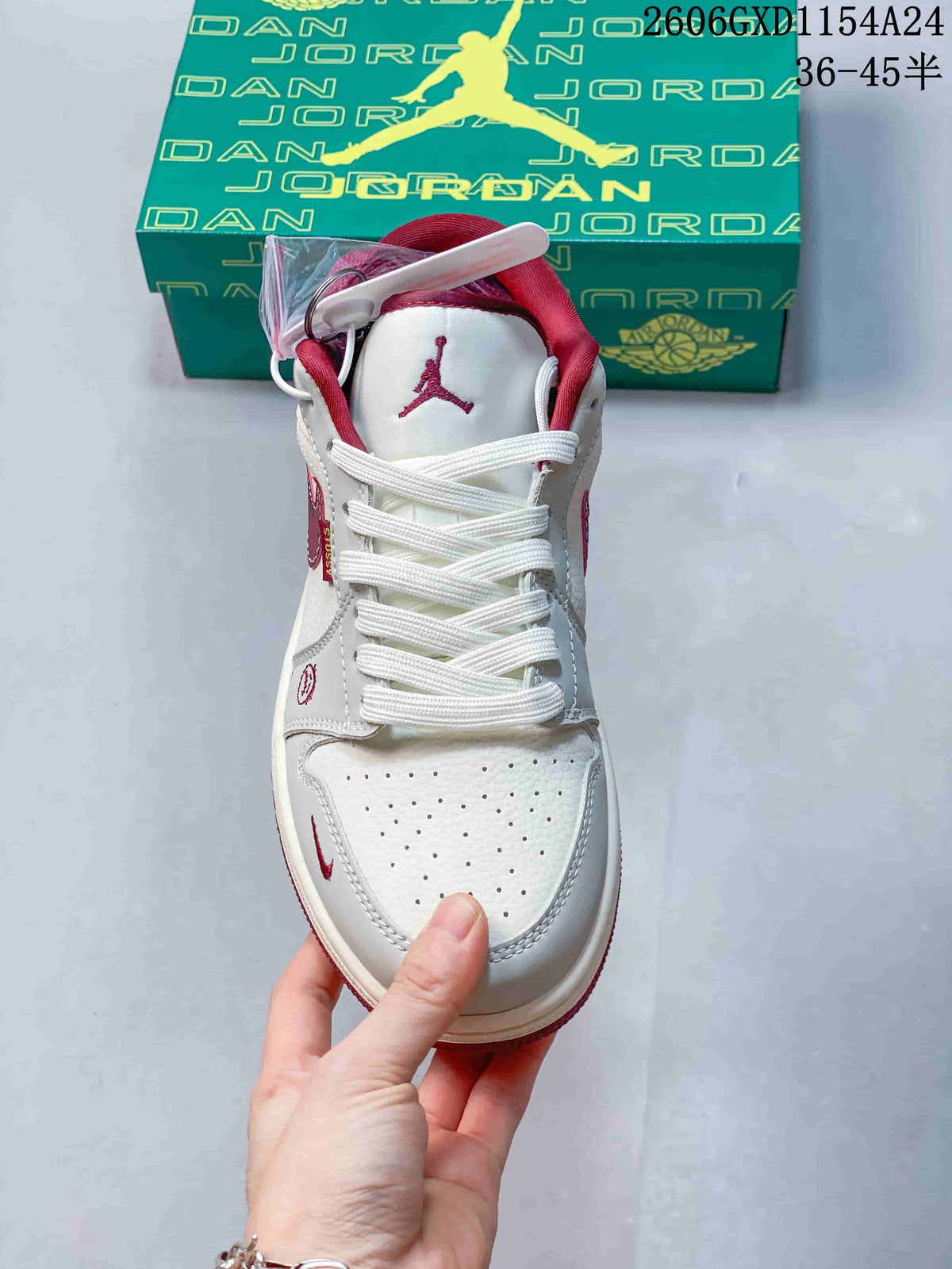 Top view showing the laces, perforated toe box, and burgundy collar accents