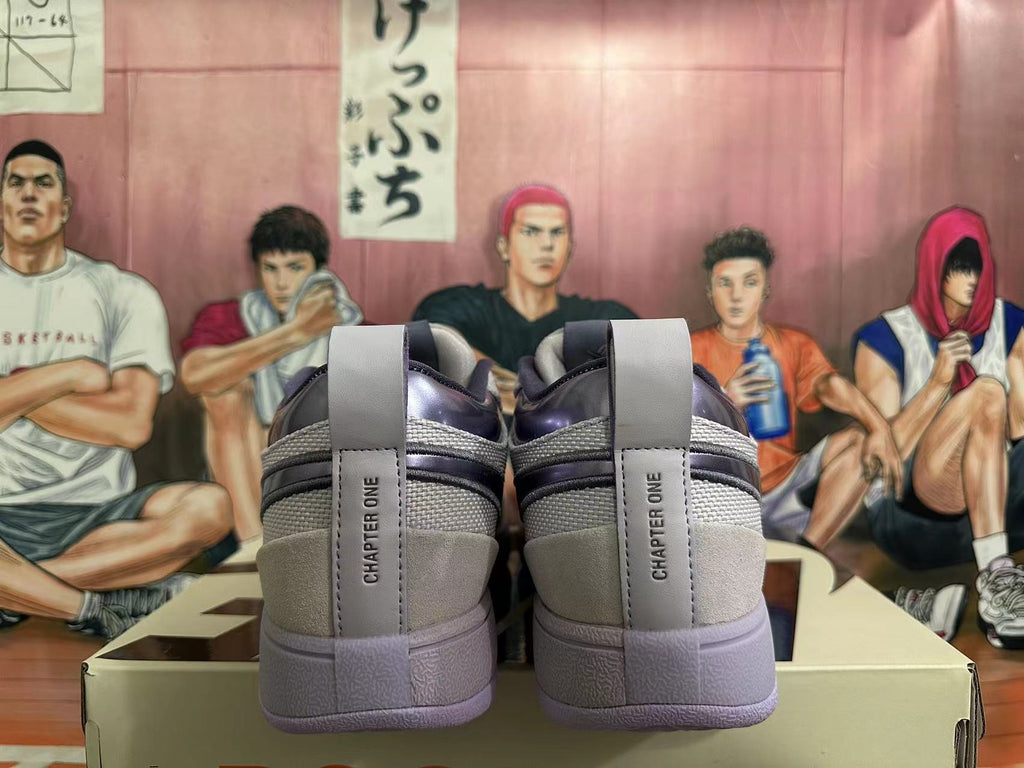 Rear view of the sneakers showing heel tabs marked “CHAPTER ONE.”