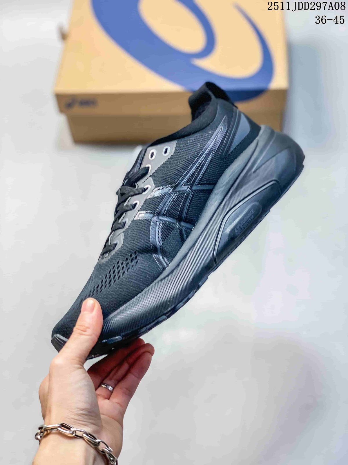 Side view of the dark gray ASICS sneaker showing the layered upper panels, lace area, and thick structured outsole.