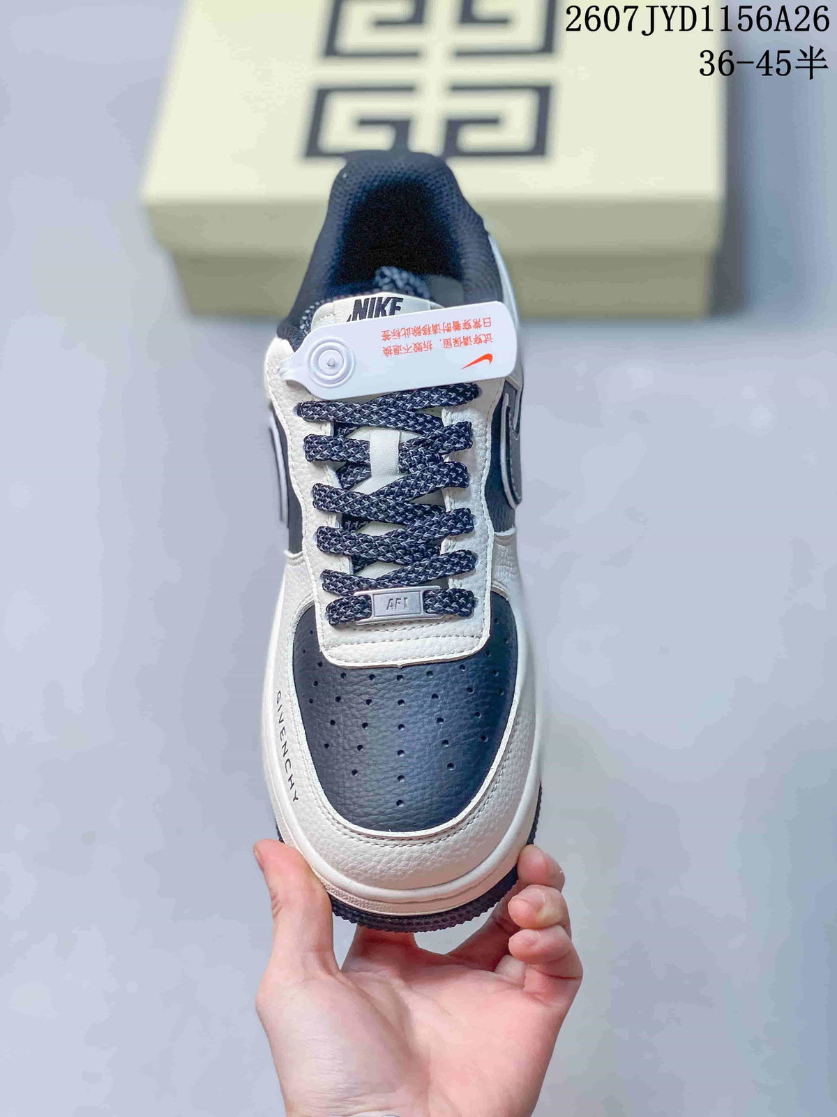Top view of the sneaker showing the perforated navy toe box, woven laces, tongue branding, and lace accessory.