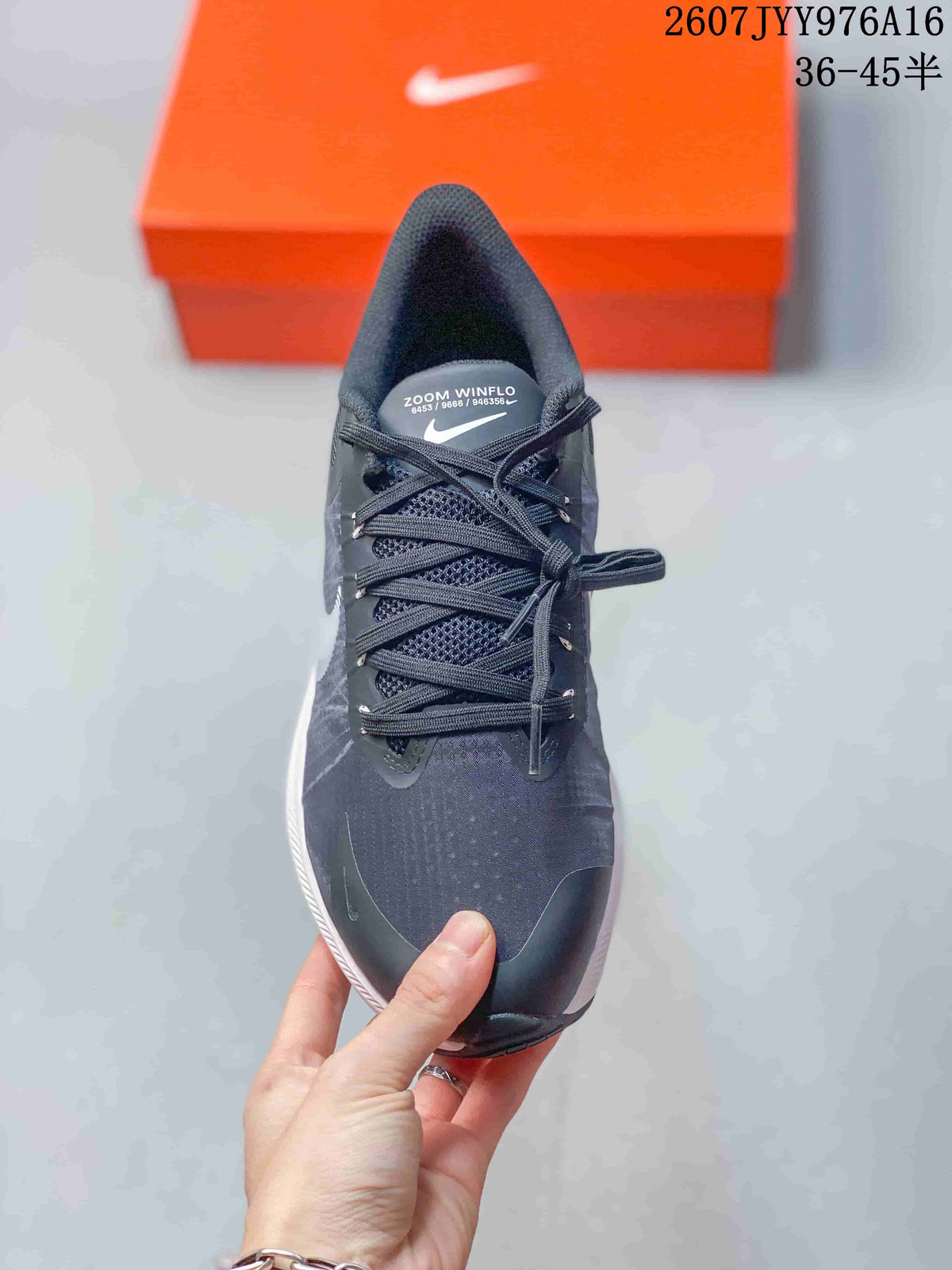 Top view showing the dark textured upper, laces, and toe area of the sneaker.