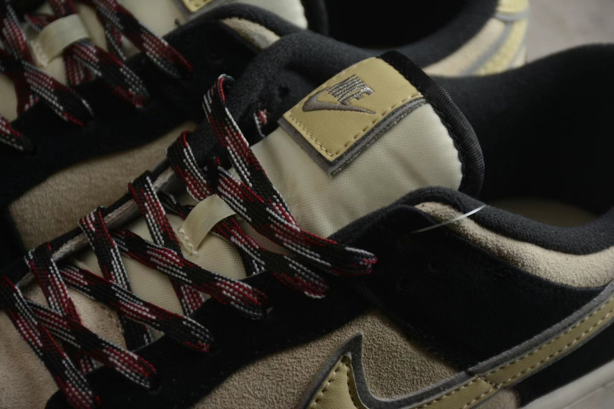 Close-up of the beige tongue, black collar, and red-and-black laces with a visible Nike tongue label.