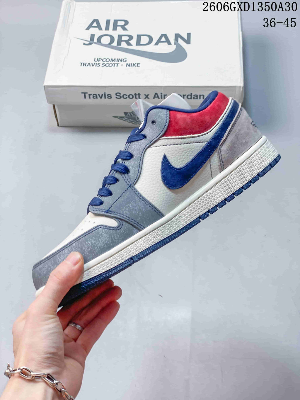 Side profile showing the blue Swoosh, patterned panel, and red heel