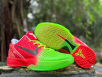 Outsole and side details of the red and green basketball shoes