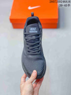Front view of the shoe showing the mesh-style toe box, laces, and tongue label reading Nike Zoom Winflo 9X.