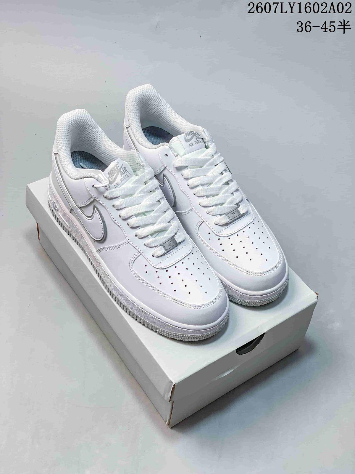 Pair of white Nike Air Force 1 '07 low-top sneakers shown on a shoebox