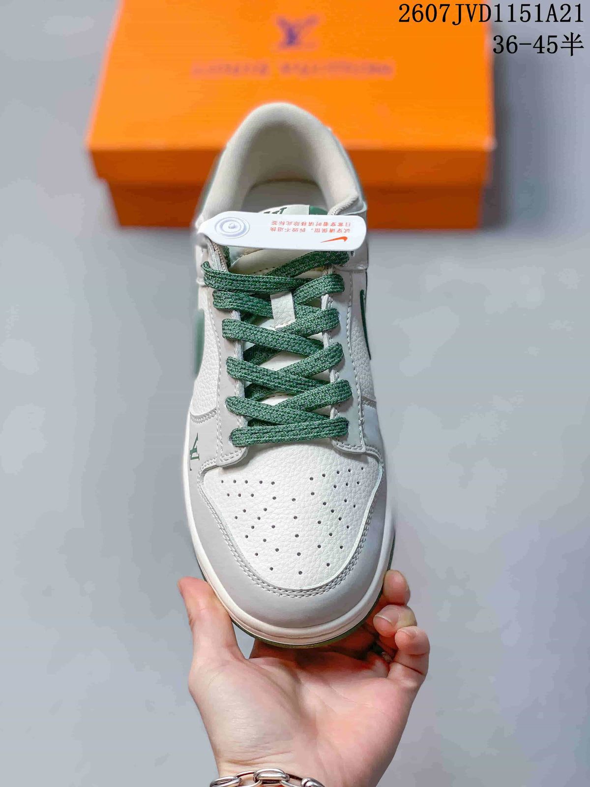 Top view of one sneaker showing the perforated white toe box, green laces, and padded collar.
