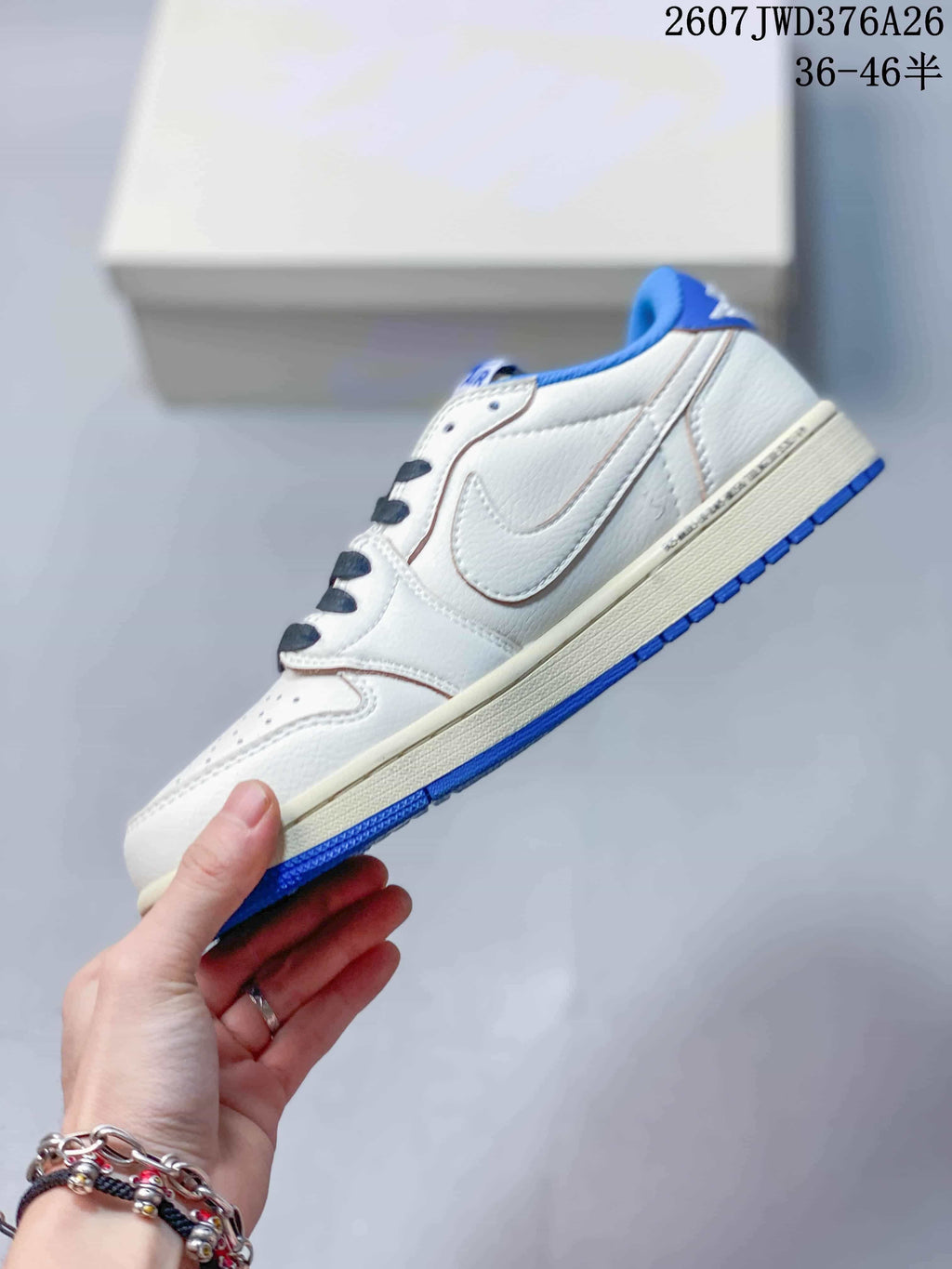 Side profile showing the white upper, blue side overlay, cream midsole, and blue outsole.