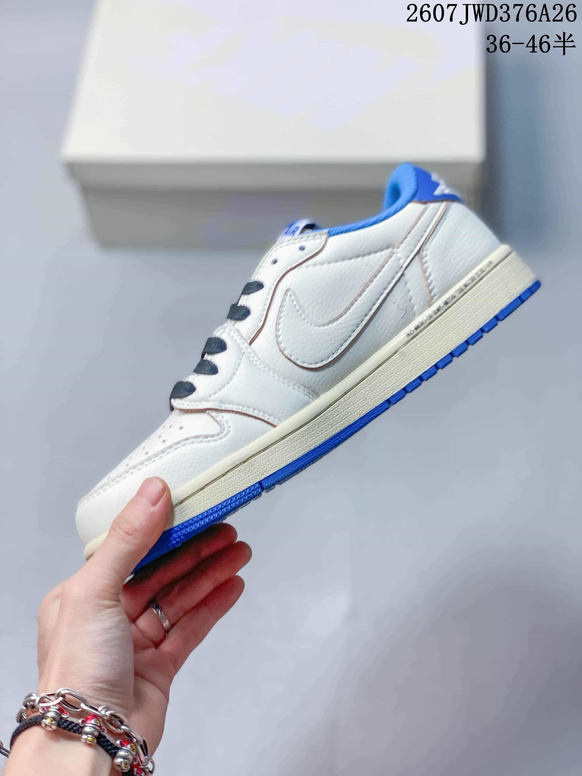Side profile showing the white upper, blue side overlay, cream midsole, and blue outsole.