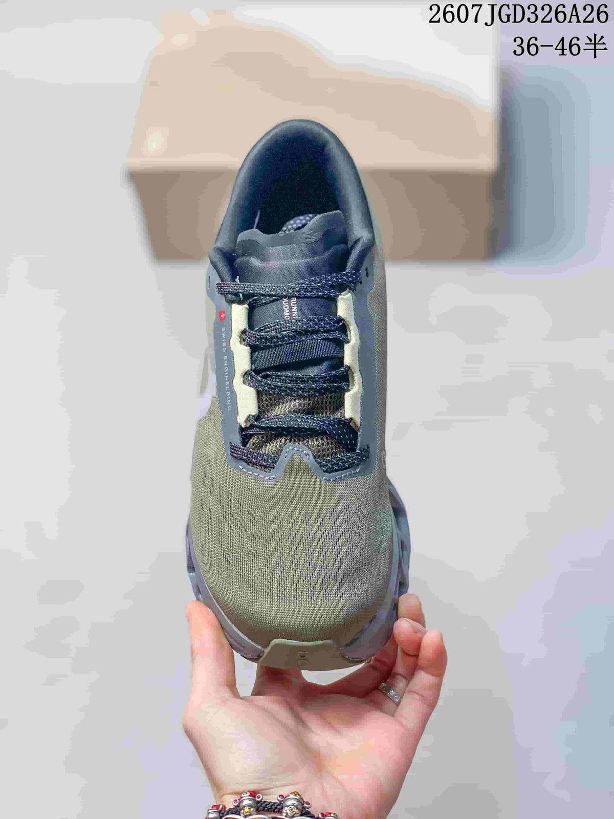 Top view of the sneaker showing the mesh-like olive upper, dark laces, padded tongue, and gray overlays.