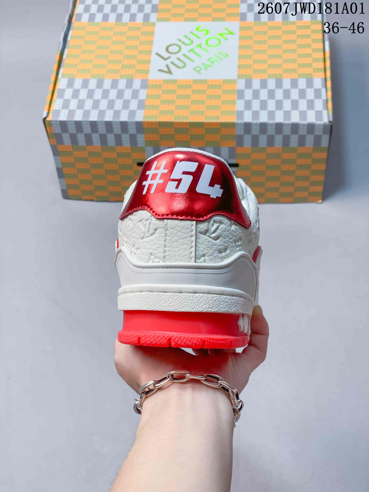 Rear view of the sneaker with a red heel panel and bright red outsole