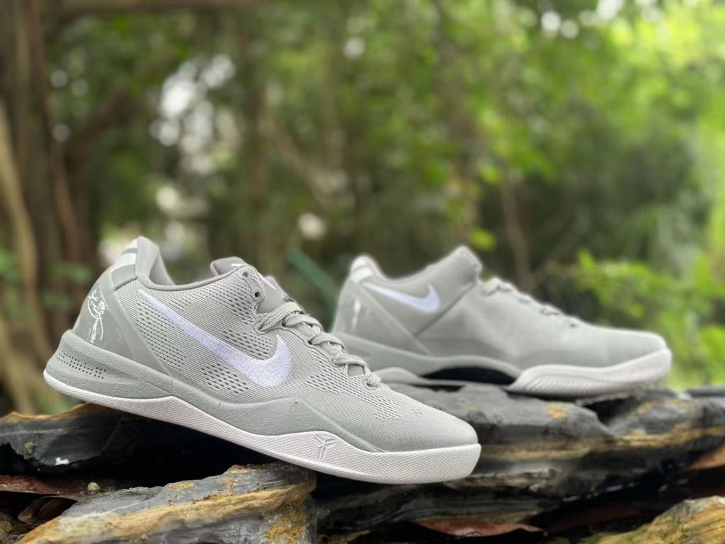 Side view of a pair of Wolf Grey Nike Kobe 8 shoes outdoors