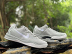 Side view of a pair of Wolf Grey Nike Kobe 8 shoes outdoors