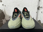 Front view of the green and grey adidas Dame 9 shoes, showing orange tongue logos and matching laces.