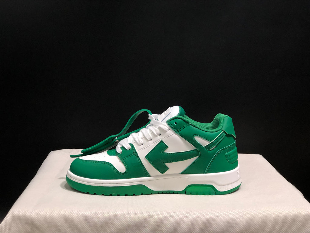 Lateral side view showing the green and white panel arrangement and low-top silhouette.