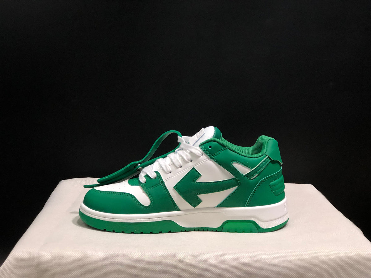 Lateral side view showing the green and white panel arrangement and low-top silhouette.