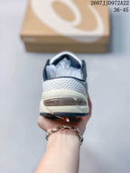 Rear view of the sneaker showing the padded heel collar, mesh heel panel, and layered heel sole; image text shows style code JJD972A22 and size range 36–45.