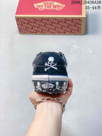 Rear view showing the white skull graphic on the black heel and skull detailing around the foxing.