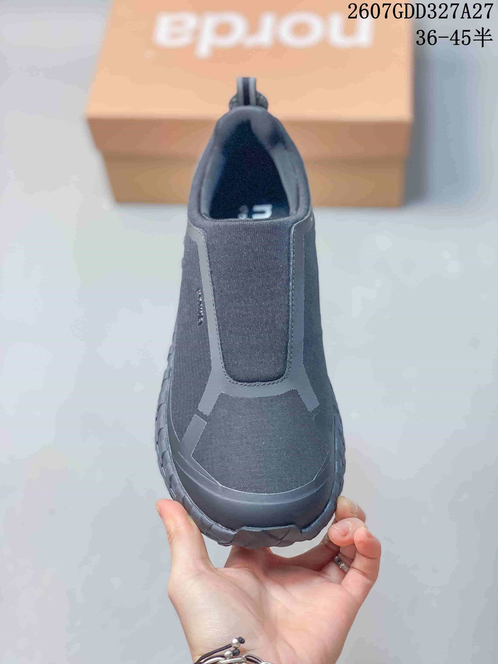 Front view of the dark charcoal slip-on hiking sneaker showing the elasticated upper panel, reinforced toe area, and tonal construction; overlay text shows style code 2607GDD327A27 and sizes 36–45.