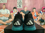 Rear view of the shoes showing black heel panels with three white Adidas stripes and teal soles.