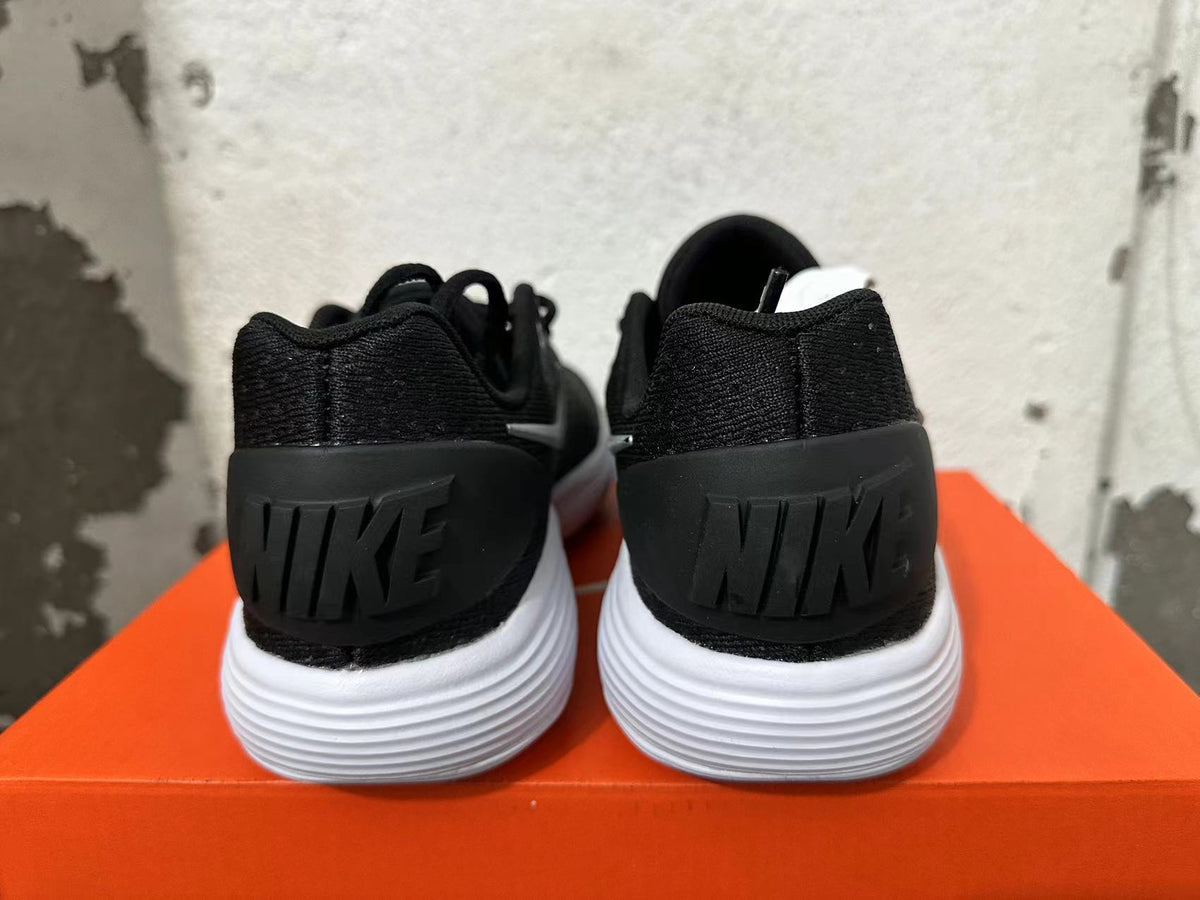 Rear view of black Nike Hyperdunk 2017 shoes with black heel panels and white ridged outsoles