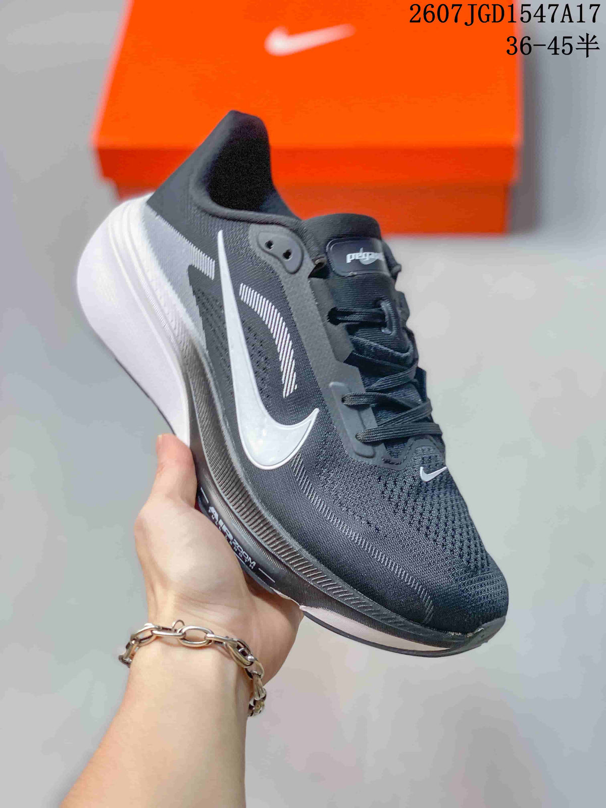 Black and dark gray Nike Air Zoom Pegasus 42 running shoe with a white Swoosh and white midsole.